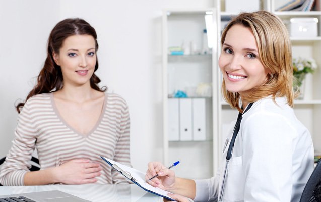 Medical tourism facilitator in India discussing treatment plans with an international patient at a JCI-accredited hospital.”